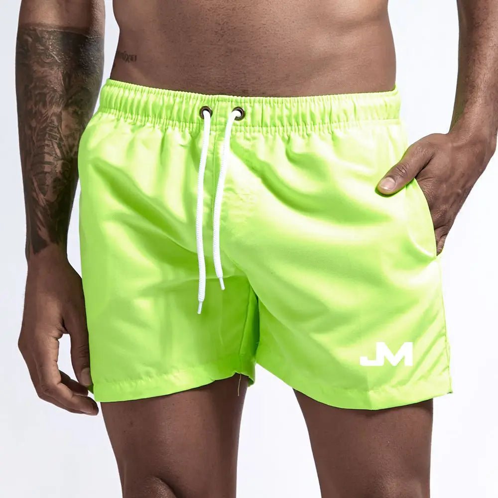 Quick drying, mid-length beach shorts Fluorescent Beachwear Australia