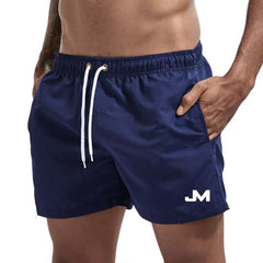 Quick drying, mid-length beach shorts Navy Beachwear Australia